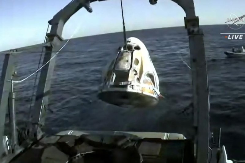 The Dragon capsule, with four astronauts aboard, is hoisted onto the recovery shop n the Atlantic Ocean off Jacksonville on Friday afternoon. Photo courtesy of NASA