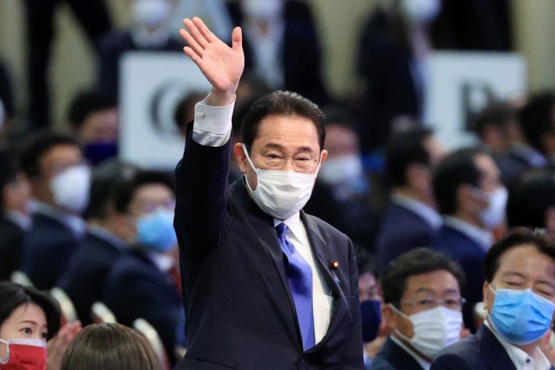 Former Japanese Foreign Minister Fumio Kishida waves on Wednesday after winning the election of the ruling Liberal Democratic Party in Tokyo. Kishida will likely succeed Yoshihide Suga as prime minister. Photo by Jiji Press/EPA-EFE