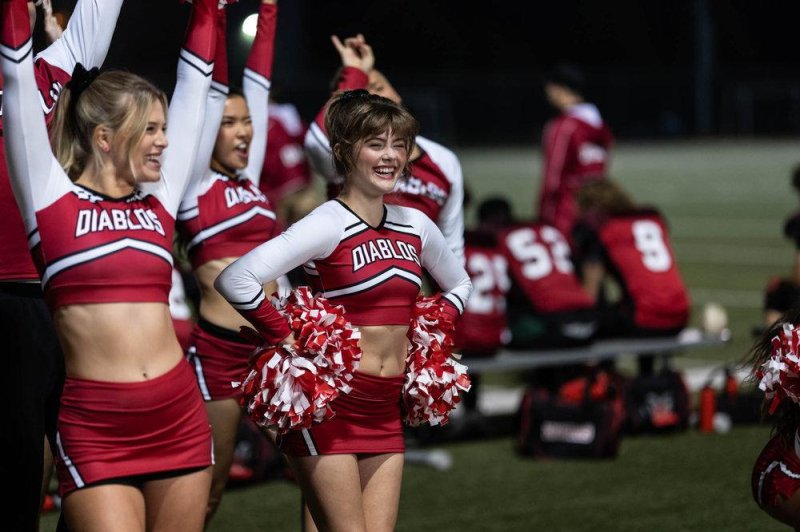 Tiera Skovbye (L) and Kerri Medders cheer for their lives in "Bring It On: Cheer or Die." Photo courtesy of Syfy