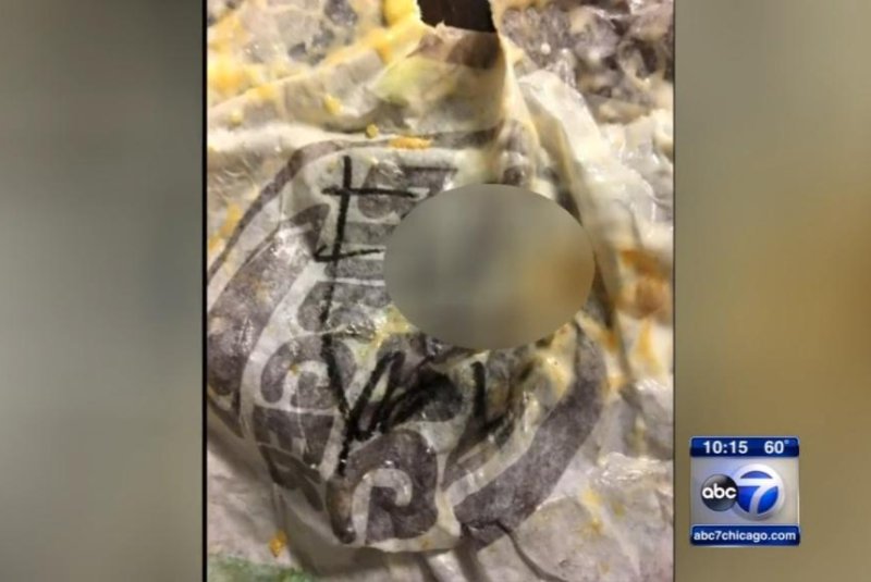 Burger King apologized to an Illinois couple after their sandwich wrappers from a Naperville store were found to bear obscene messages. Screenshot: WLS-TV