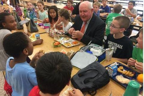 Secretary of Agriculture Sonny Perdue eats lunch with students at Catoctin Elementary School in Leesburg, Va., on Mondayto mark School Nutrition Employee Week. Photo courtesy of the USDA