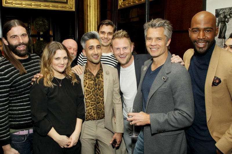 The stars of "Queer Eye" -- left to right, Jonathan Van Ness, Tan France, Antoni Porowski, Bobby Berk and Karamo Brown -- pose with Drew Barrymore and Timothy Olyphant from "Santa Clarita Diet" at a Netflix cocktail party in New York on Jan. 30. Photo courtesy of Netflix
