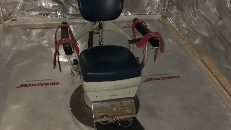 Police discovered a dental chair in one of the converted shipping containers whose intended purpose is believed to be a torture chamber. Photo courtesy of National Prosecutor's Office/Website
