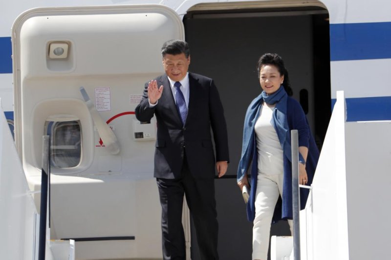 President of China, Xi Jinping (L) and his wife, Peng Liyuan (R), arrive at the Hamburg International Airport ahead of the G20 summit in Hamburg, Germany. Earlier in Berlin Xi met with South Korean President Moon Jae-in and expressed support for the peaceful denuclearization of the Korean peninsula. Photo by Carsten Koall/EPA