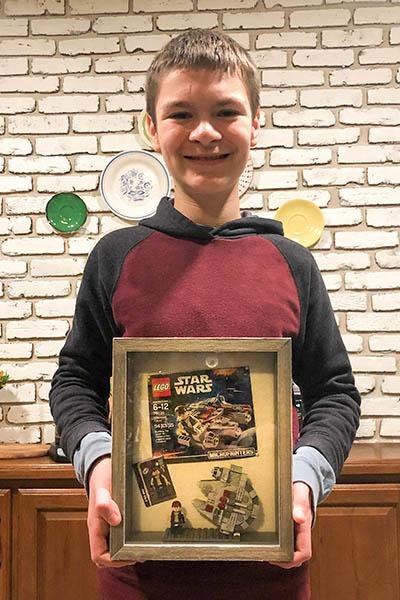 Haddon Haste, 12, of Louisville, Ky., broke a Guinness World Record by assembling a Lego "Star Wars" Millennium Falcon micro fighter kit in 1 minute, 59.72 seconds. Photo courtesy of Guinness World Records
