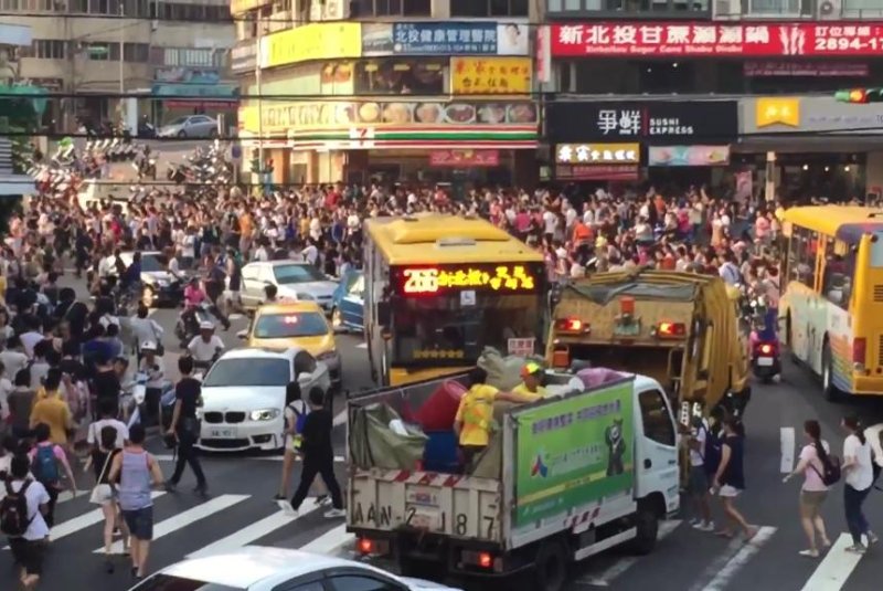 A stampede of "Pokemon Go" players stream through a Taipei street in search of a Snorlax. Screenshot: Storyful