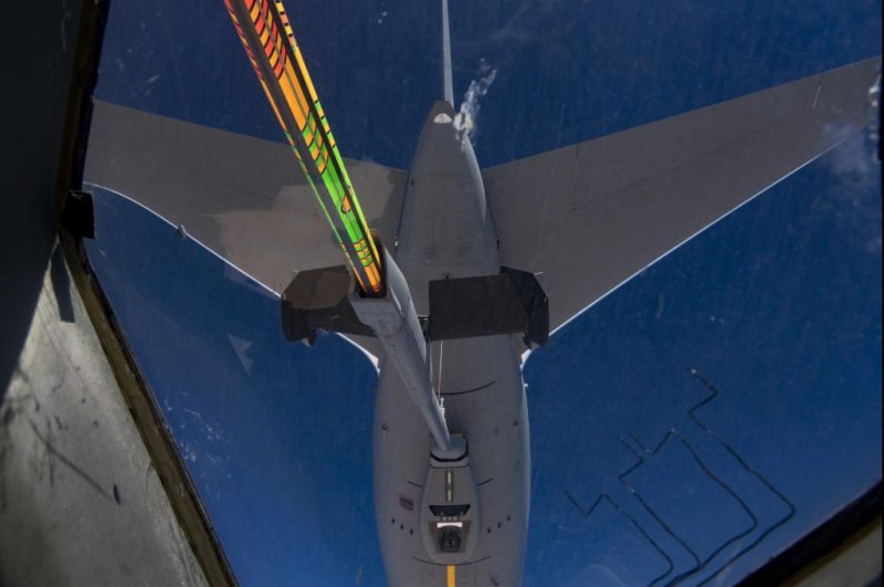 A 22nd Air Refueling Wing KC-46A refuels a C-17 Globemaster III from Joint Base Lewis McChord's 62nd Airlift Wing over the Arabian Gulf on Nov. 23. Photo by Staff Sgt. Daniel Snider/U.S. Air Force