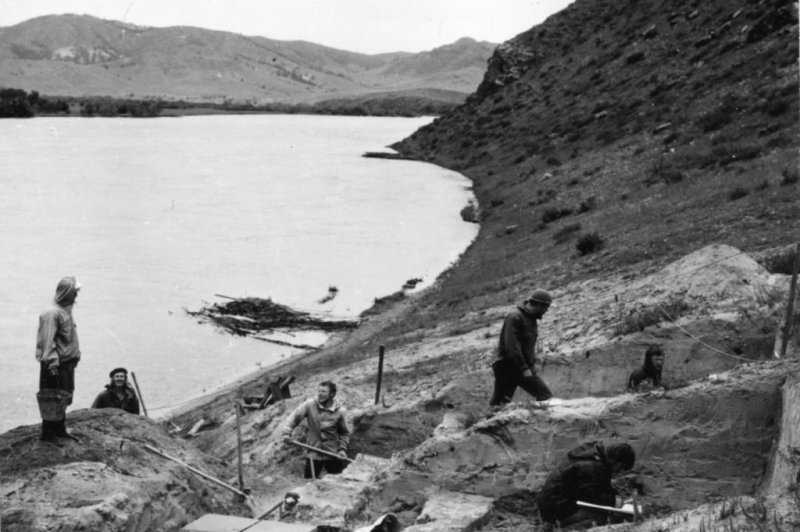 Siberia's Lake Baikal region has been populated by modern humans since the Upper Paleolithic. Ancient populations left behind an extensive archaeological record. This photo shows the 1976 excavation of the Ust'-Kyakhta-3 site located on Russia's Selenga River. Photo by A. P. Okladnikov <br>
