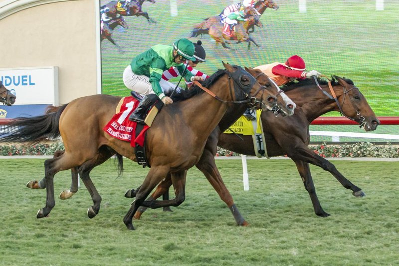 Planetario (foreground) wins the Hollywood Turf Cup. Benoit photo, courtesy of Del Mar Turf Club