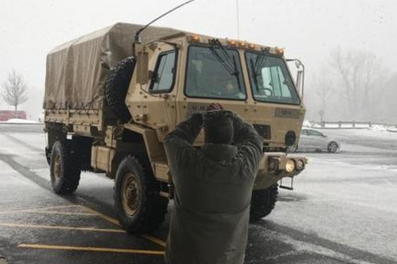 Lt. Col. Joseph Chodnicki, a New York Army National Guard officer who was overseeing emergency operations in Putnam County, guides and FMTV truck into place during a health and wellness check at a Putnam County nursing home on March 7, 2018. Photo courtesy of the New York National Guard.