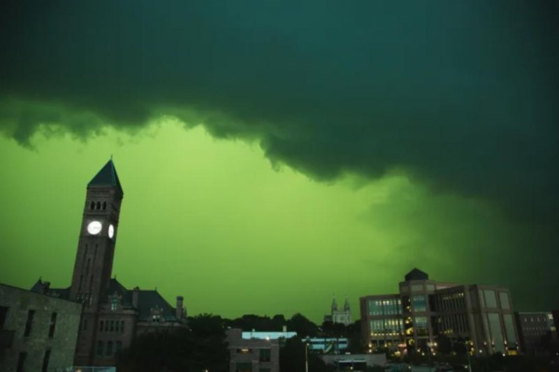 The sky turns green during a severe storm in downtown Sioux Falls, S.D., on Tuesday. Photo by Jkarmill/Twitter via AccuWeather