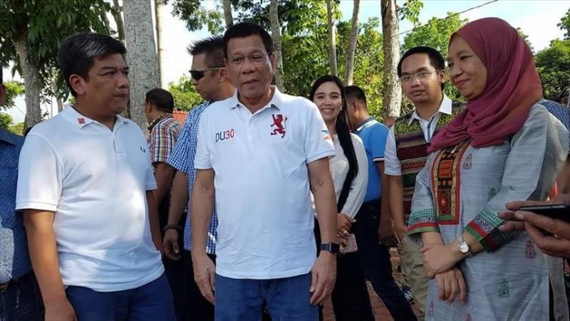 Philippine President Rodrigo Duterte, center, called for peace Thursday as he visited the country's Autonomous Region in Muslim Mindanao. Photo courtesy of Anadolu Agency