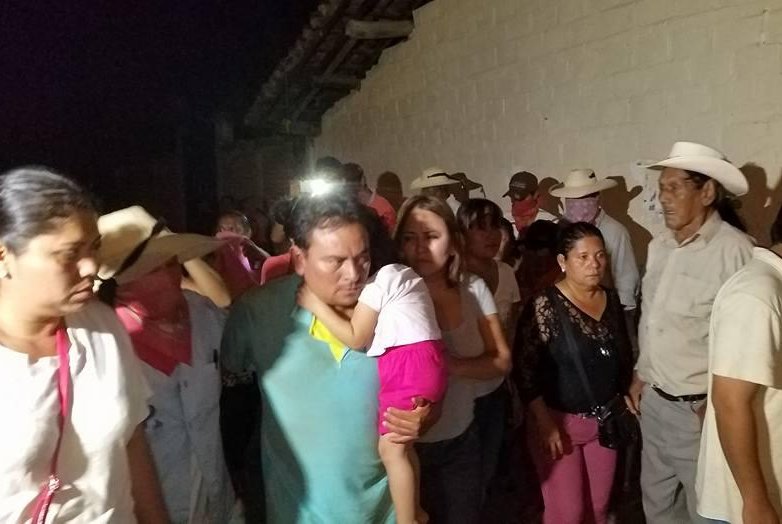 Isauro de Paz Duquem, seen holding his child amid local residents, was freed late Wednesday after a hostage exchange in Mexico's Guerrero state. After Paz Duquem was kidnapped on Sunday, locals formed a vigilante group and kidnapped the mother of the leader of the gang that allegedly kidnapped Paz Duquem. The mother was also released Wednesday. Photo courtesy of Cecilio Pineda/Facebook