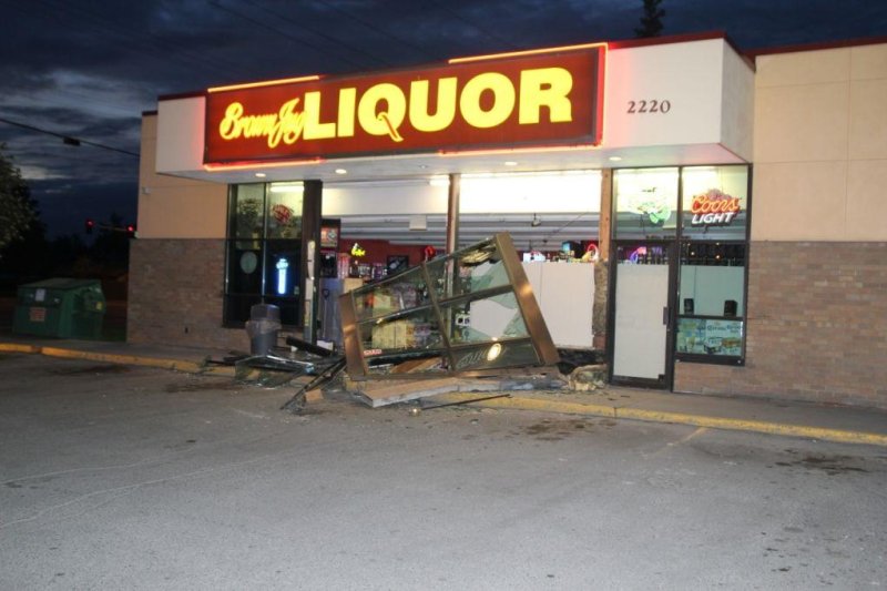 An Anchorage liquor store damaged by a suspect who crashed a front-end loader into the shop. Photo courtesy of the Anchorage Police Department