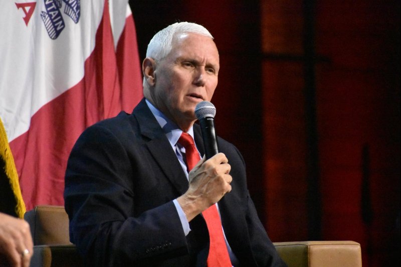 Former Vice President Mike Pence answers a question from Iowa Faith and Freedom Coalition Chairman Ralph Reed during the organization's fall gala on Saturday in Des Moines, Iowa. Photo by Joe Fisher/UPI