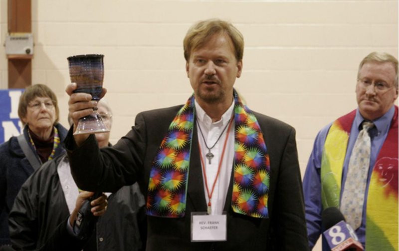 United Methodist Rev. Frank Schaefer serves communion to his supporters at the end of his two-day church trial. (Kathy L. Gilbert/United Methodist News Service.)