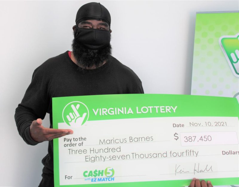 Maricus "Bezo" Barnes of Hampton, Va., said the lottery ticket he found while doing his laundry nearly ended up in the trash before he discovered it was a&nbsp;$387,450 winner. Photo courtesy of the Virginia Lottery