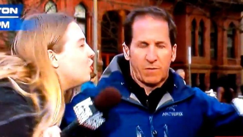 Reporter stops two women from kissing him during Boston coverage