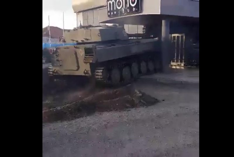 A nightclub promotion involving a tank goes spectacularly awry. Screenshot courtesy of Club Mono/Facebook
