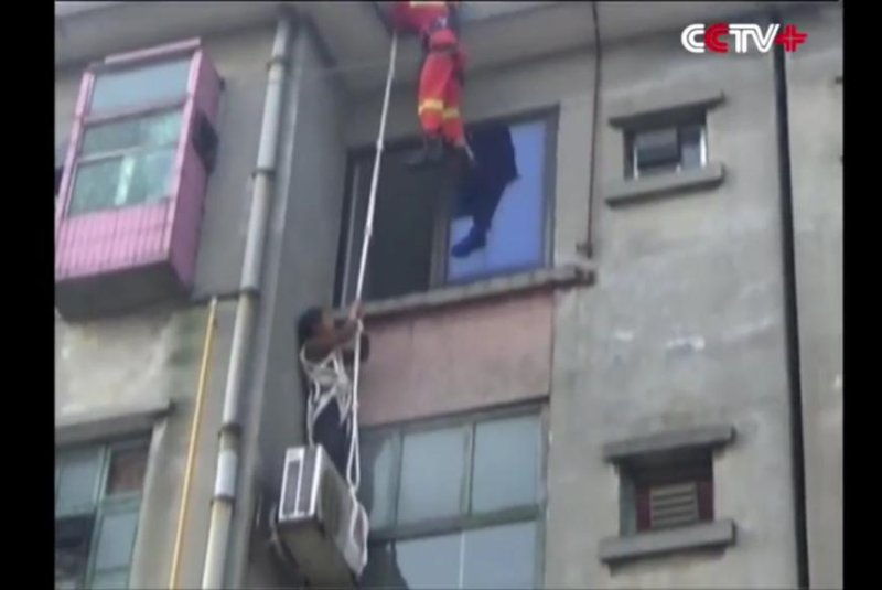 Woman, 63, rescued after trying to rappel to her apartment window