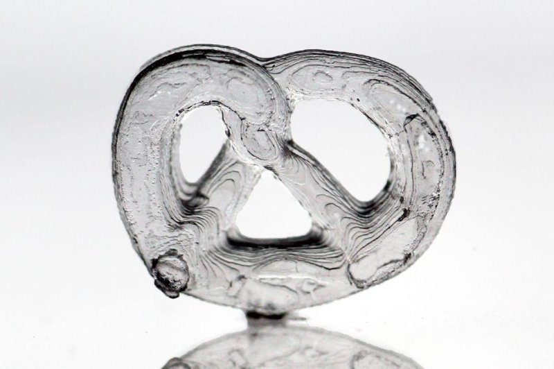 Researchers used their new 3D-printing technique to create a variety of intricate and complex glass structures, including a glass pretzel. Photo by KIT