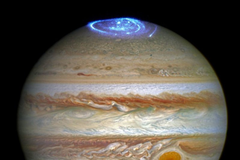 Hubble astronomers superimposed recent imagery of Jupiter's auroras onto an older portrait of the gas giant. Photo by Hubble/NASA/ESA