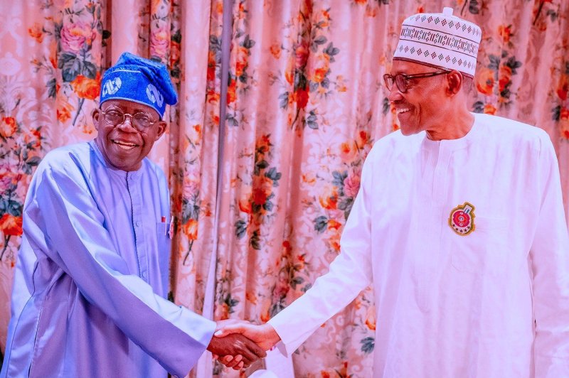 Nigerian President Muhammadu Buhari (R) congratulates Bola Ahmed Tinbutu after being declared the winner on Wednesday of the country's presidential election. Photo courtesy of Muhammadu Buhari/Twitter