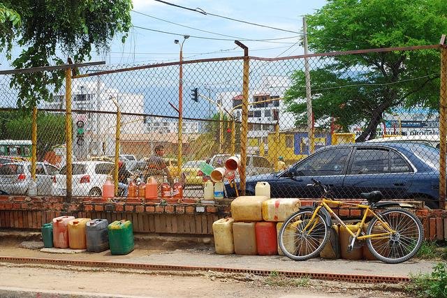 A "gas station" in Cucuta, Colombia, bordering Venezuela. Gasoline is often smuggled across the border from Venezuela where it is cheaper than water and sold on the Colombian streets. File Photo by Celine Massa/Flickr