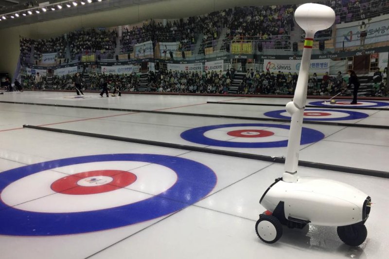 Curly consists of one artificial intelligence system and two physical robots, a thrower and a skipper. The skipper, pictured above, uses a camera to interpret changing ice conditions and coordinate strategy. Photo by Korea University