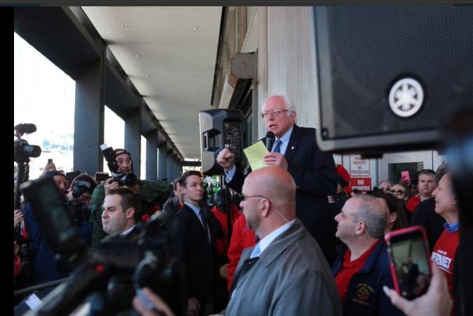 This photo, circulated by the Bernie Sanders campaign on Twitter, shows the candidate speaking to a crowd of Verizon workers who walked out on strike Wednesday morning. Sanders, who has received the endorsement of one of the striking unions, the Communications Workers of America, thanked the workers for fighting for "justice against corporate greed." Photo courtesy of the Sanders campaign