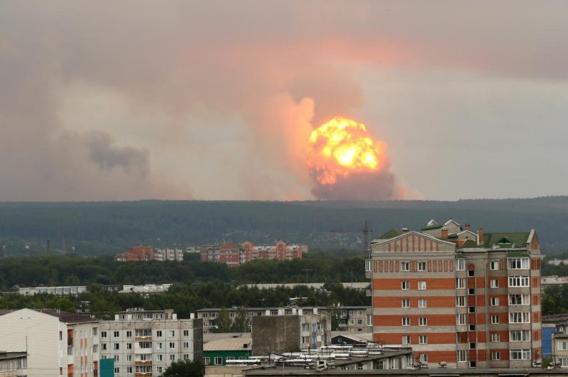 Explosions are seen August 5 at a military ammunition depot near Achinsk, Russia. Three days later, an explosion and a release of radiation occurred in Nenoska. File Photo by Smitry Dub/EPA-EFE