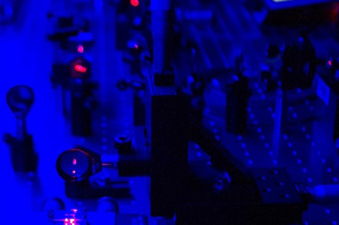 In the lab, scientists use lasers, crystals and beam splitters to entangle photons and then send them to disparate locations. Photo by Elsa Hahne/ORED