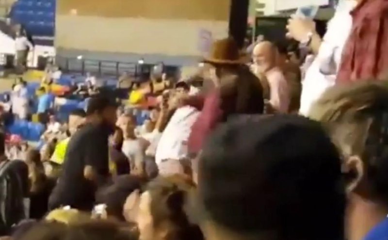 Five deputies in North Carolina were disciplined for failing to act when a Donald Trump supporter (wearing the cowboy hat) sucker punched a protestor as they were escorting the protestor out of a rally last week. All five were suspended without pay and put on probation for a year. Three were demoted. Screen shot: Washington Post