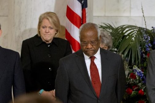 Ginni Thomas stands next to her husband, Supreme Court Justice Clarence Thomas, during a private ceremony in the Great Hall of the Supreme Court for the late Supreme Court Justice Antonin Scalia on February 2016. File Photo by Jacquelyn Martin/EPA