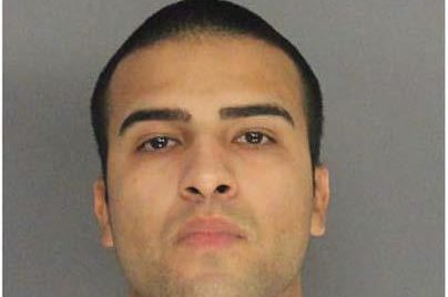Louis Santiago, a Newark police officer, faces multiple charges for allegedly hitting a pedestrian in his car and taking the body home with him. Photo courtesy of the Essex County Prosecutor's Office