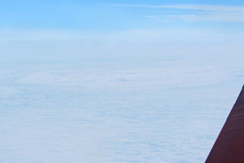 The potential meteorite impact site seen from AWI's Polar 6 aircraft. Photo by Tobias Binder, Alfred Wegener Institute.