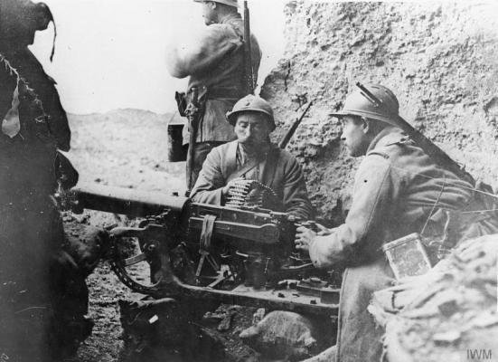 French troops man a captured German Maxim MG 08 machine gun mounted on a sledge at Fort Douaumont, Verdun, ca. 1916. File Photo courtesy Imperial War Museums