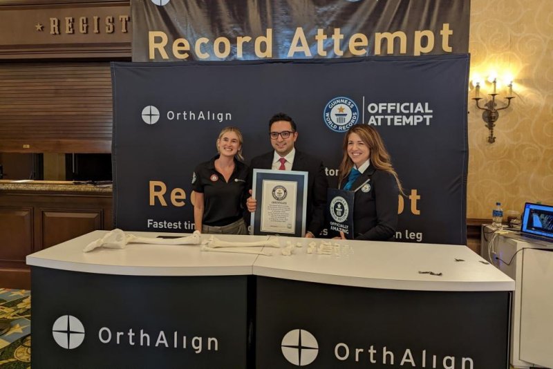 Guinness World Records officials presented Dr. Alisina Shahi with a certificate for the fastest time to arrange all the bones of the human leg at the American Association for Hip and Knee Surgeons 2022 Annual Meeting in Texas. Photo courtesy of OrthAlign
