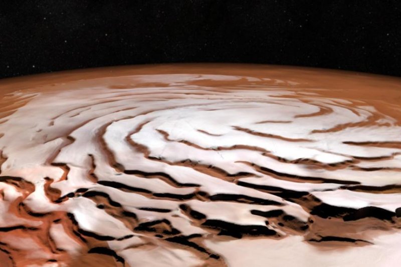 The rotational pattern of Mars' polar ice cap resembles a tropical storm system. Photo by ESA
