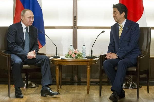 Japanese Prime Minister Shinzo Abe and Russian President Vladimir Putin have agreed to expand cooperation in the Kuril Islands, but Putin said this week U.S. military buildup could take place if Japan gains sovereignty over the disputed territory. File Pool Photo by Alexander Zemlianichenko/EPA