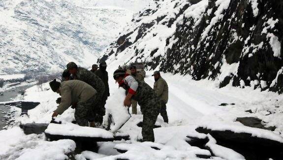 Rescuers search for casualties in Chitral, Pakistan, on Monday after three days of heavy snow led to avalanches on the Pakistan-Afghanistan border. At least 117 people died in the two countries. Photo by Hammad Khan Farooqi/EPA