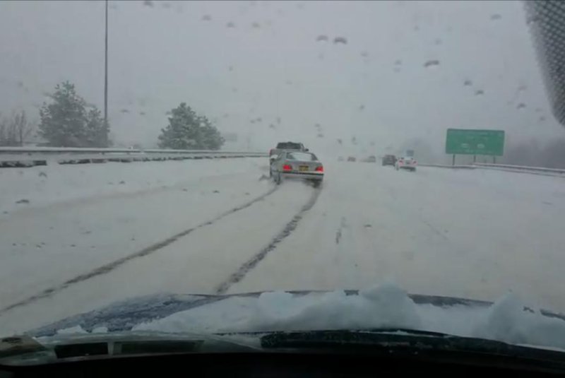 The "best, worst driver in the history of a snowstorm" swerves around a Rochester, N.Y. road. Screenshot: Storyful