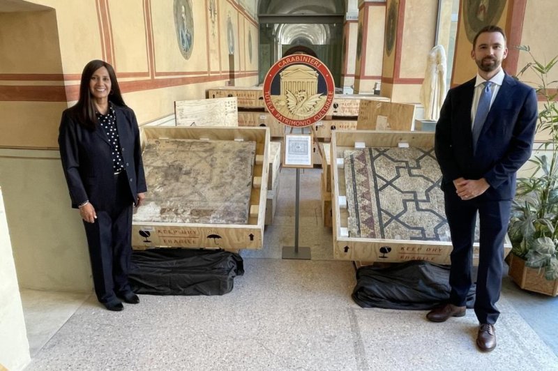 Special Agents Elizabeth Rivas and Allen Grove traveled to Italy for the repatriation of the mosaic to its home in Rome. Photo courtesy of FBI