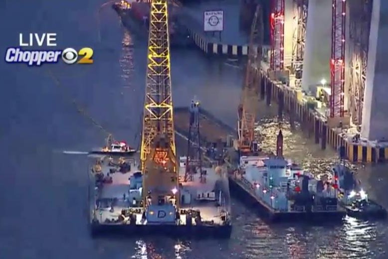 A massive crane is being moved into position to hoist a tugboat that crashed near New York City's Tappan Zee Bridge and sank, killing three crew members. Screenshot from CBS New York