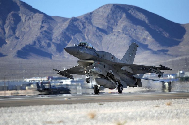 An F-16E from Al Dhafra Air Base, United Arab Emirates, lands at Nellis Air Force Base in Nevada following a Red Flag air combat training exercise. U. S. Air Force photo by Tech. Sgt. Michael R. Holzworth