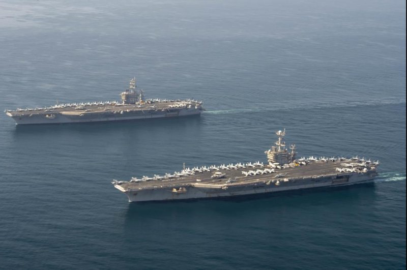 The aircraft carriers USS Dwight D. Eisenhower, top, and USS Harry S. Truman transit the Arabian Sea Tuesday. Photo by Keith Simmons/U.S. Navy&nbsp;