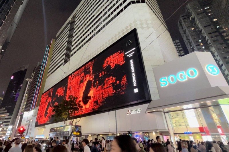 A Hong Kong department store has taken down a work of glitch art made by Patrick Amadon, who snuck messages of support for pro-democracy protesters into the video animation. Photo courtesy of Patrick Amadon