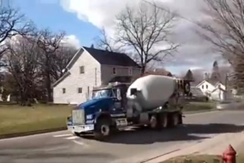 An 11-year-old boy in Minnesota is accused of leading police on an hour-long chase in a cement mixer truck. Screenshot: JukinMedia