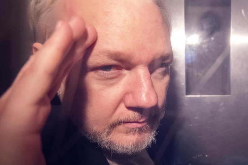 Wikileaks co-founder Julian Assange is seen in a prison van Wednesday as he leaves Southwark Crown Court in London, Britain. Photo by Facundo Arrizabalaga/EPA-EFE