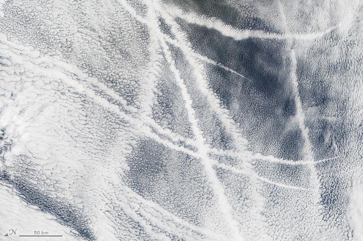 Clouds induced by ship exhaust appear as the letter A off the coast of Russia. Photo by NASA/EO/MODIS